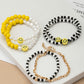 6 beaded bracelets set with polymer smiley face